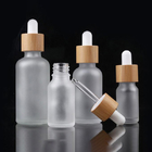 Custom Glass Cosmetic Serum Bottle 30ml 1oz Frosted Round Shoulder Dropper Bottle For Essential Oils